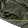 A close-up view of the interior of a green bag, showing a zippered pocket with a black connector inside. Produktbild-Vorschau