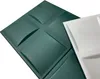 Two 3D wall panels, one green and one white, are shown in a close-up shot against a white background. Produktbild-Vorschau