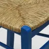 Close-up of a blue wooden chair with a woven straw seat. Produktbild-Vorschau