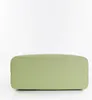 The bottom view of a green handbag on a white background. Produktbild-Vorschau