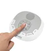 A hand is pressing a button on a white and gray baby sleep aid device. Náhľad obrázku produktu