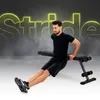 A man is performing a dip exercise on a black weight bench. The background is dark with glowing yellow text that spells out "Stride". Podgląd zdjęcia produktu