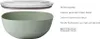A green salad bowl with a clear lid, shown separately. Text describes its features. Produktbild-Vorschau