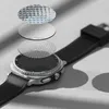 A smartwatch with layers of protective glass shown above it, illustrating its construction. Produktbild-Vorschau