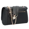 A black Guess handbag with a gold chain strap. Produktbild-Vorschau