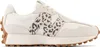 A side view of a New Balance sneaker. Voir les images du produit