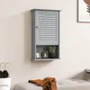 A grey bathroom wall cabinet with a louvered door and an open shelf below, mounted on a light-colored wall. Podgląd zdjęcia produktu