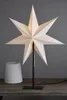 A white star-shaped lamp and a lampshade on a wooden table against a gray background. Podgląd zdjęcia produktu