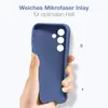 A hand holding a blue phone case against a white background. Produktbild-Vorschau