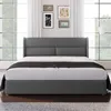 A grey upholstered bed with a dark throw blanket is shown in a room with large windows and curtains. Anteprima dell’immagine prodotto