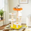 A cat is resting on a multi-tiered cat tree with flower-shaped platforms in a living room setting. Podgląd zdjęcia produktu