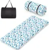 A rolled-up futon mattress with a leaf pattern, an unrolled futon mattress with the same pattern, and a black carrying bag are displayed against a white background. Náhled obrázku produktu