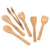 A collection of wooden kitchen utensils arranged on a white background. Podgląd zdjęcia produktu