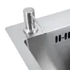 A close-up view of a stainless steel kitchen sink with a soap dispenser. Náhled obrázku produktu