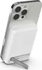 A white Belkin power bank is attached to the back of a silver smartphone, with a kickstand extended. Voir les images du produit