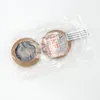 Two brown ear pads are shown in a clear plastic bag on a white background. Produktbild-Vorschau