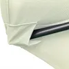A close-up view of the fabric and metal pole of a patio umbrella. Voir les images du produit