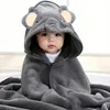 A baby wearing a hooded towel with an elephant design. Produktbild-Vorschau