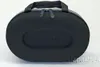 A black oval-shaped case with a handle and zippers, sitting on a white background. Náhľad obrázku produktu