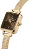 A close-up shot of a gold-colored women's watch with a brown face, set against a white background. Voir les images du produit