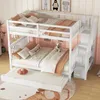 A white bunk bed with a pull-out trundle bed, decorated with pillows and a teddy bear, in a child's bedroom. Produktbild-Vorschau