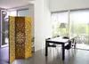 A room with a dining table and chairs, with a decorative screen in the foreground. Náhľad obrázku produktu