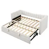 A white daybed with its pull-out bed extended, showing the slatted wooden base. Anteprima dell’immagine prodotto