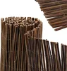 A close-up view of rolled-up and unrolled bamboo fencing. Produktbild-Vorschau