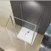 A shower cabin with glass doors and a white base, shown from a high angle. Produktbild-Vorschau