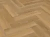 A close-up view of a herringbone-patterned wood-look floor. Produktbild-Vorschau