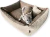 A French bulldog lies in a brown corduroy dog bed. Produktbild-Vorschau