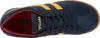 A top-down view of a blue Gola sneaker with yellow stripes and a red interior. Produktbild-Vorschau