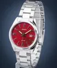 A close-up studio shot of a silver Casio watch with a red dial, displayed on a stand against a blue background. Anteprima dell’immagine prodotto