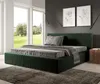 A modern bedroom with a green upholstered bed, large windows overlooking a garden, and minimalist artwork on the wall. Produktbild-Vorschau