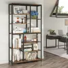 A tall, multi-shelf bookshelf filled with decorative items and books, placed in a home office setting next to a desk with a laptop. Podgląd zdjęcia produktu