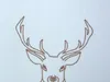 A close-up of a deer's head and antlers, embroidered with brown thread on a light blue textured background. Produktbild-Vorschau