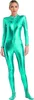 A woman is standing and posing in a full-body metallic green jumpsuit. Náhled obrázku produktu