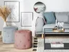 A living room scene with a sofa, coffee table, and two poufs. Náhľad obrázku produktu