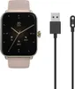 A smartwatch and its charging cable are displayed against a white background. Náhled obrázku produktu