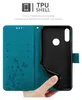 A hand is holding open a teal phone case, revealing the black TPU shell inside. Náhled obrázku produktu