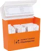 An open orange dispenser box filled with individually wrapped bandages, with a clear lid showing a form. Náhled obrázku produktu