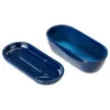 Two blue ceramic oval dishes, one nested inside the other, are shown against a white background. Náhled obrázku produktu