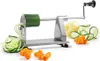 A spiralizer is shown with spiralized zucchini and carrots. Náhled obrázku produktu