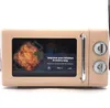 A beige retro microwave with a digital display showing food and text. Produktbild-Vorschau