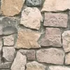 A close-up view of a stone wall texture. Produktbild-Vorschau