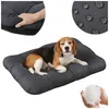 A beagle dog is resting on a dark gray dog bed. The image also shows close-ups of the bed's material and filling. Produktbild-Vorschau