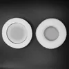 Two white headphone ear pads are shown on a black background. Náhled obrázku produktu
