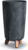 A dark gray planter with a textured finish and three wooden legs. Anteprima dell’immagine prodotto