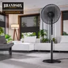 A modern living room with a stand fan, sofa, and lamp. Voir les images du produit