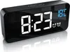A digital alarm clock with a black casing and a reflective screen displaying the time and temperature. Náhľad obrázku produktu